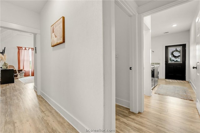 corridor featuring light hardwood / wood-style flooring