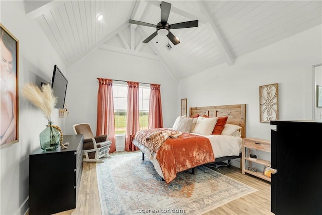 bedroom with beamed ceiling, light hardwood / wood-style floors, high vaulted ceiling, and ceiling fan