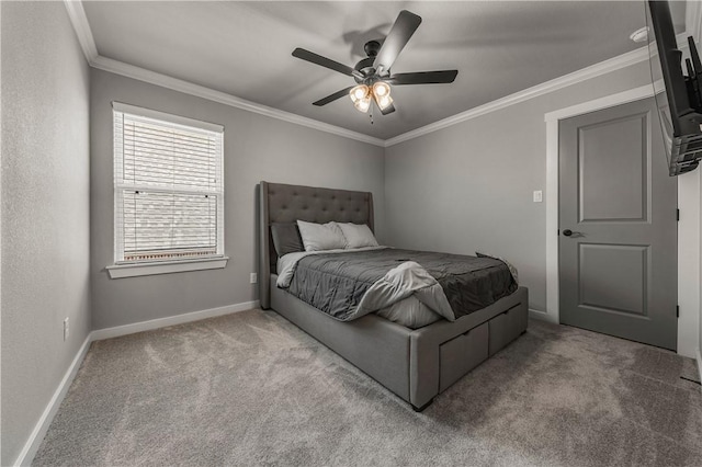 carpeted bedroom with ornamental molding and ceiling fan