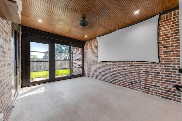 unfurnished sunroom with wood ceiling