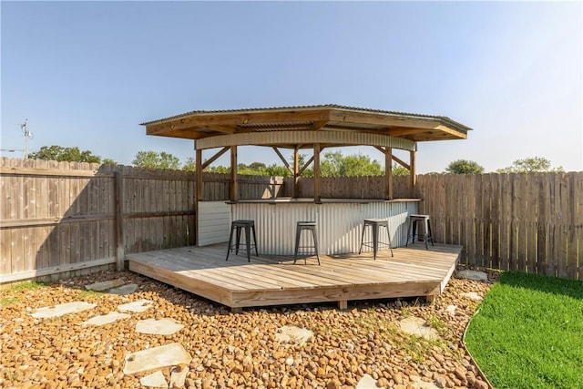 wooden terrace featuring an outdoor bar