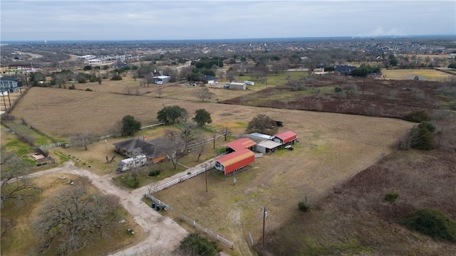 birds eye view of property with a rural view