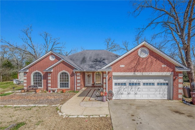 view of front of home with concrete driveway, brick siding, an attached garage, and roof with shingles