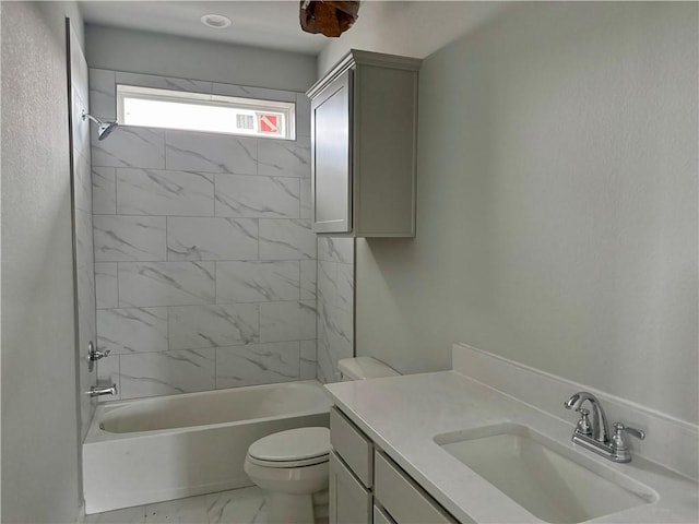 full bathroom featuring vanity, toilet, and tiled shower / bath