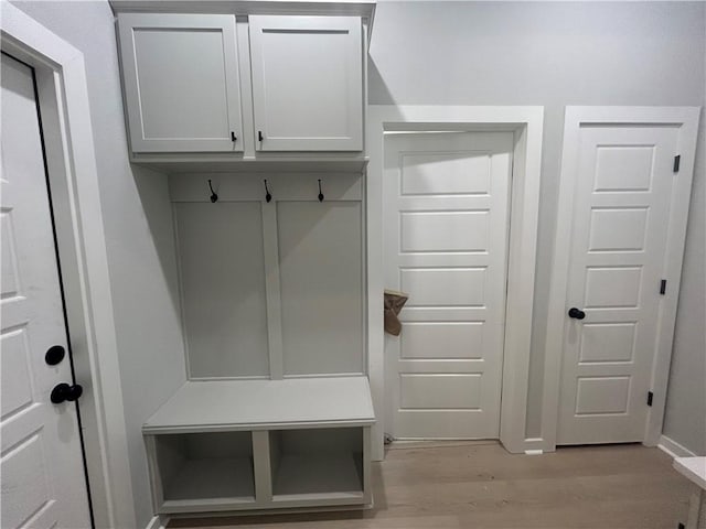 mudroom with light wood-style floors