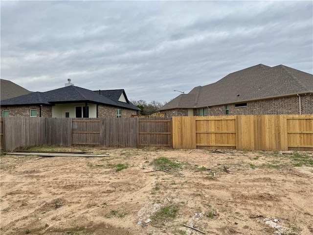 view of yard featuring a fenced backyard