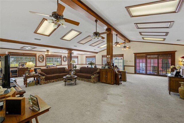 living room featuring carpet, lofted ceiling with beams, and ornate columns