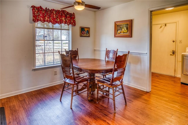 6196 Fm 975, Caldwell, TX 77836 - dining space featuring ceiling fan, washer / clothes dryer, and light hardwood / wood-style flooring