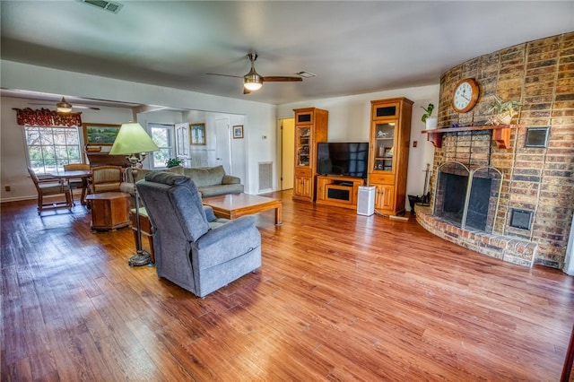 6196 Fm 975, Caldwell, TX 77836 - living room with hardwood / wood-style flooring, a fireplace, and ceiling fan