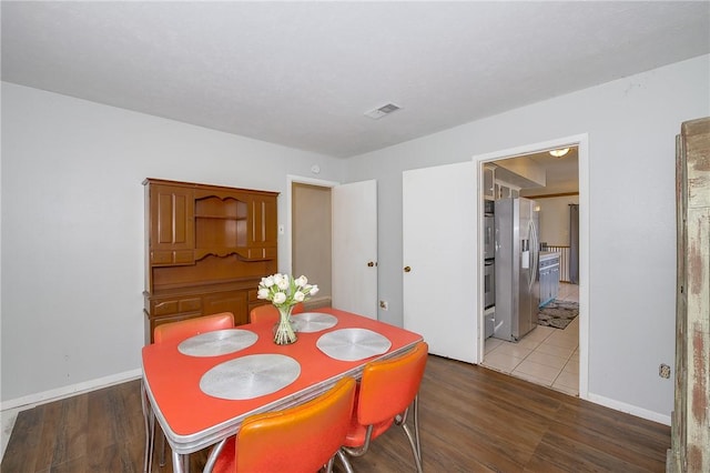 dining area featuring hardwood / wood-style flooring