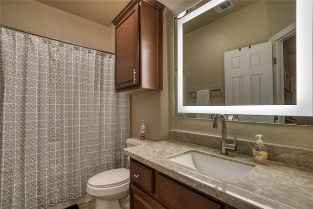 full bath with toilet, visible vents, and vanity