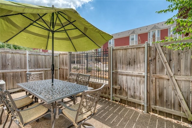 view of patio / terrace featuring fence