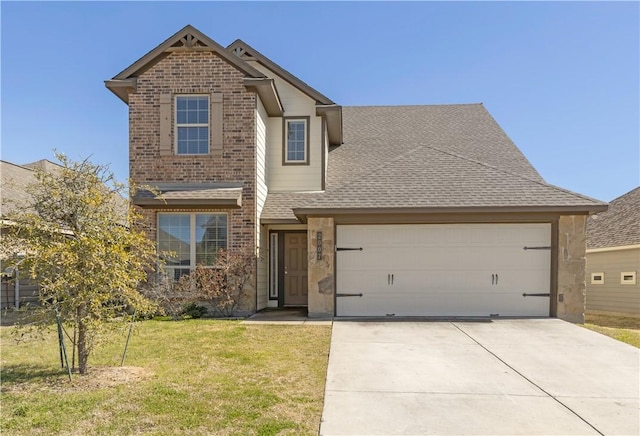 traditional-style home with an attached garage, a shingled roof, a front lawn, concrete driveway, and brick siding