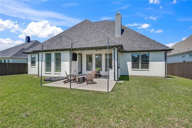 4302 Fox River Ln, Bryan, TX 77802 - back of house featuring a lawn, a fenced backyard, a chimney, and a shingled roof