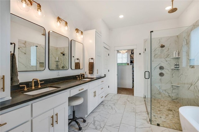 4302 Fox River Ln, Bryan, TX 77802 - full bathroom with double vanity, a marble finish shower, a freestanding bath, marble finish floor, and a sink