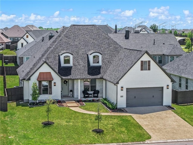 4302 Fox River Ln, Bryan, TX 77802 - view of front facade featuring a residential view, a front lawn, fence, and a shingled roof