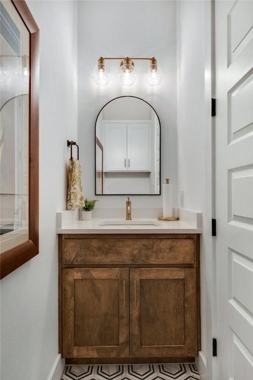 4302 Fox River Ln, Bryan, TX 77802 - bathroom with vanity and baseboards