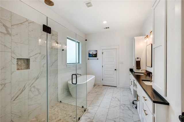 4302 Fox River Ln, Bryan, TX 77802 - bathroom featuring vanity, marble finish floor, visible vents, and a marble finish shower