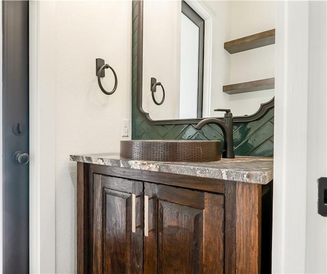 10017 Panther Creek Dr, Iola, TX 77861 - bathroom with decorative backsplash and vanity