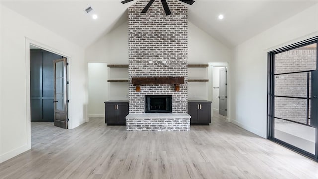 10017 Panther Creek Dr, Iola, TX 77861 - unfurnished living room featuring a ceiling fan, high vaulted ceiling, light wood-style flooring, and baseboards