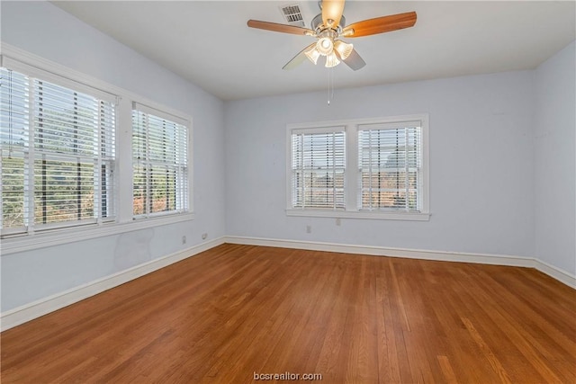 unfurnished room featuring ceiling fan and wood-type flooring