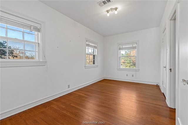 unfurnished bedroom featuring hardwood / wood-style flooring