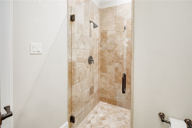 bathroom featuring a shower stall