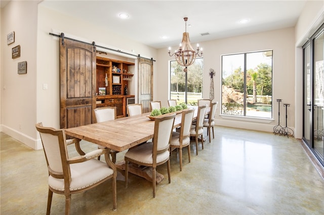 dining area with recessed lighting, a barn door, baseboards, concrete flooring, and a chandelier