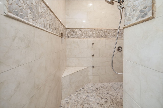 bathroom with tiled shower