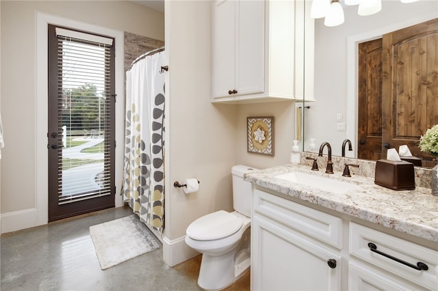 bathroom with vanity, baseboards, concrete flooring, curtained shower, and toilet