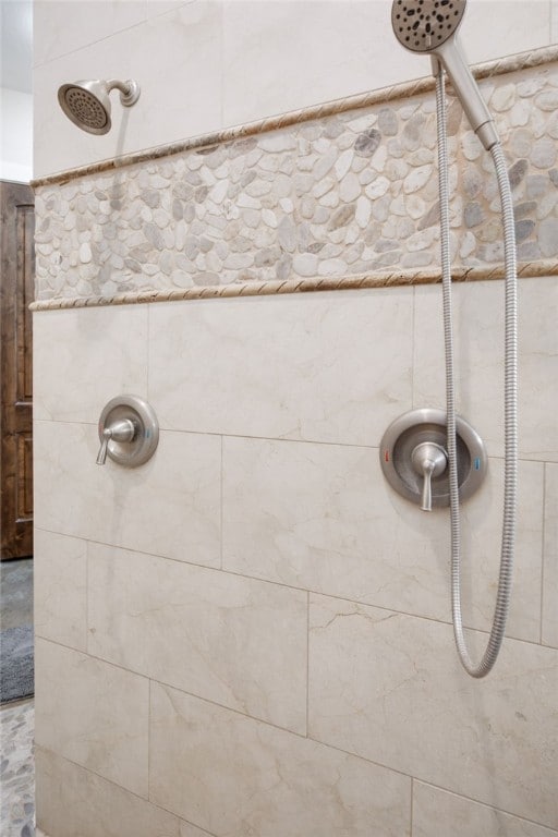 full bathroom with a tile shower