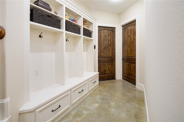 mudroom with concrete floors