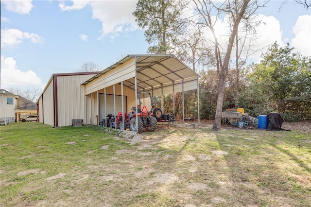 view of pole building featuring a yard and driveway