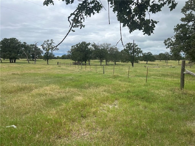 view of yard with a rural view