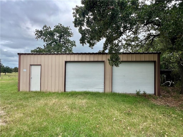 garage featuring a yard