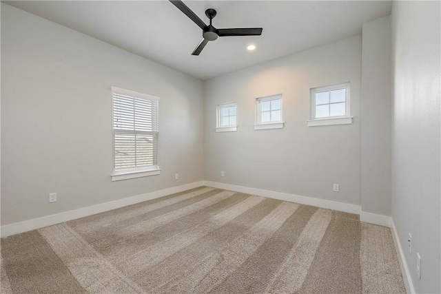 empty room featuring carpet flooring and ceiling fan