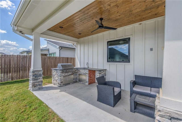 view of patio / terrace with ceiling fan, area for grilling, sink, and a grill