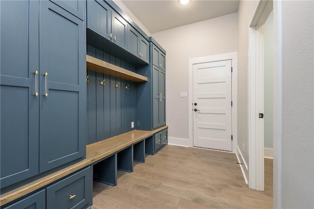 mudroom with light hardwood / wood-style floors