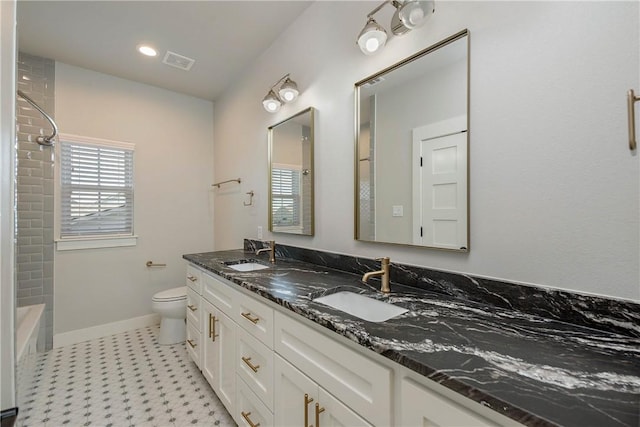 full bathroom with tile patterned flooring, vanity, bathtub / shower combination, and toilet