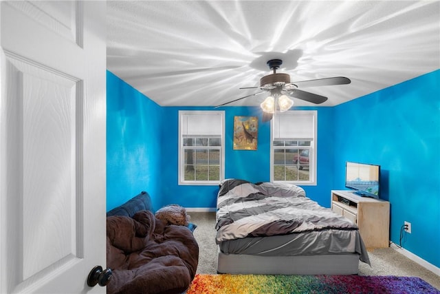 carpeted bedroom with ceiling fan