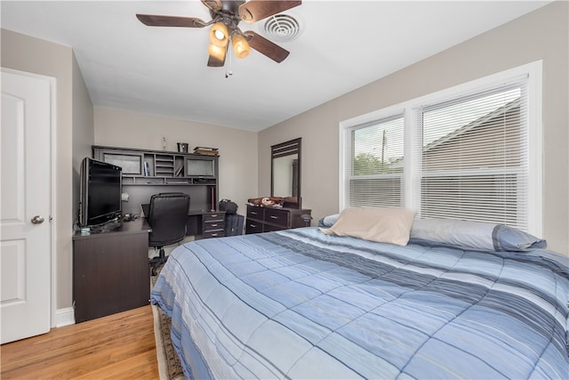 bedroom with visible vents, ceiling fan, and light wood-type flooring
