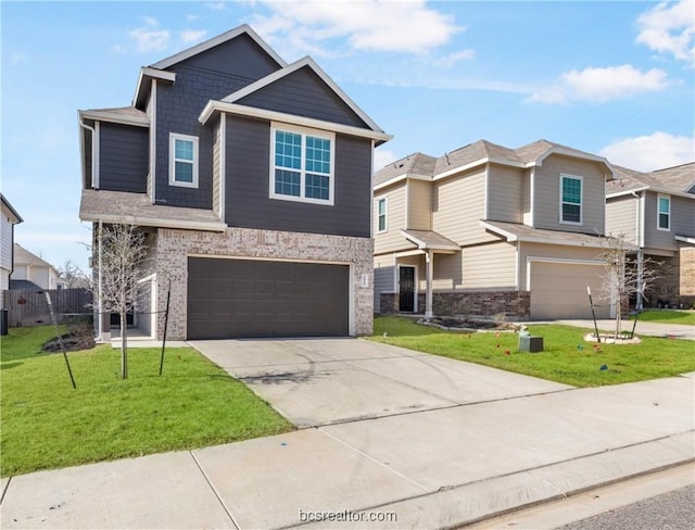 view of front of home featuring a front yard and a garage