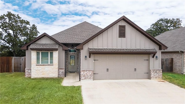 view of front of home featuring a garage and a front lawn