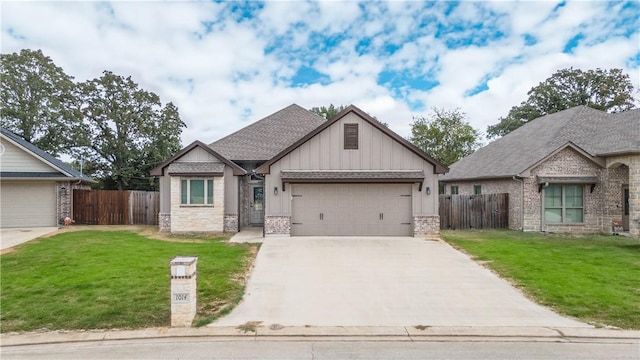 view of front of house with a garage and a front lawn