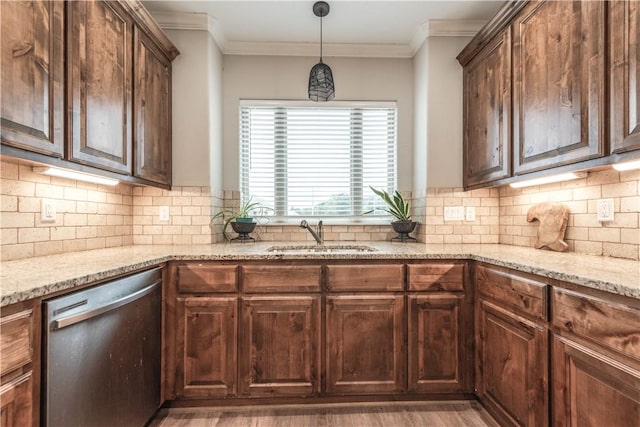 1014 Copperas Bnd, Caldwell, TX 77836 - kitchen featuring a sink, dishwasher, light stone countertops, light wood-type flooring, and decorative backsplash