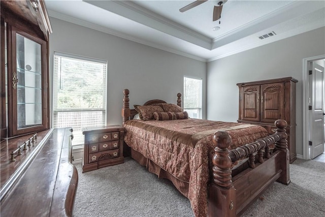 carpeted bedroom with multiple windows, ceiling fan, and crown molding