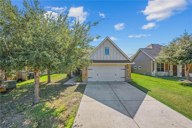 view of front of home featuring a front yard and a garage