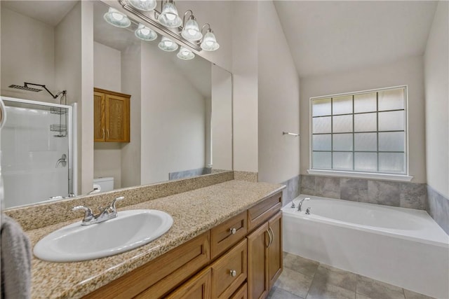 full bathroom featuring vanity, separate shower and tub, tile patterned flooring, toilet, and lofted ceiling