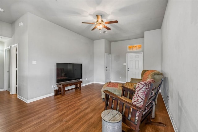 living room featuring ceiling fan and wood-type flooring