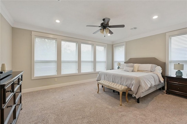 bedroom featuring multiple windows, ceiling fan, light carpet, and ornamental molding